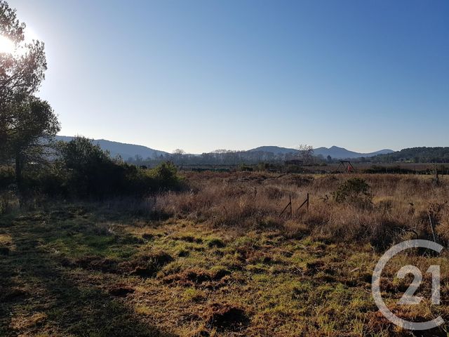 Afficher la photo en grand terrain à vendre - 1000.0 m2 - LA CRAU - 83 - PROVENCE-ALPES-COTE-D-AZUR - Century 21 Le Rocher